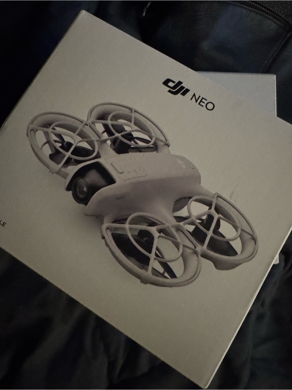 DJI Mini Drone Packaging - White and Red Accents comes with land options as well